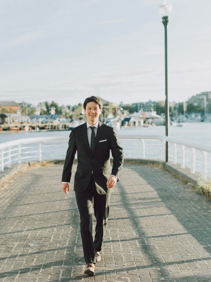 Alan Yeh walking along the Vancouver waterfront