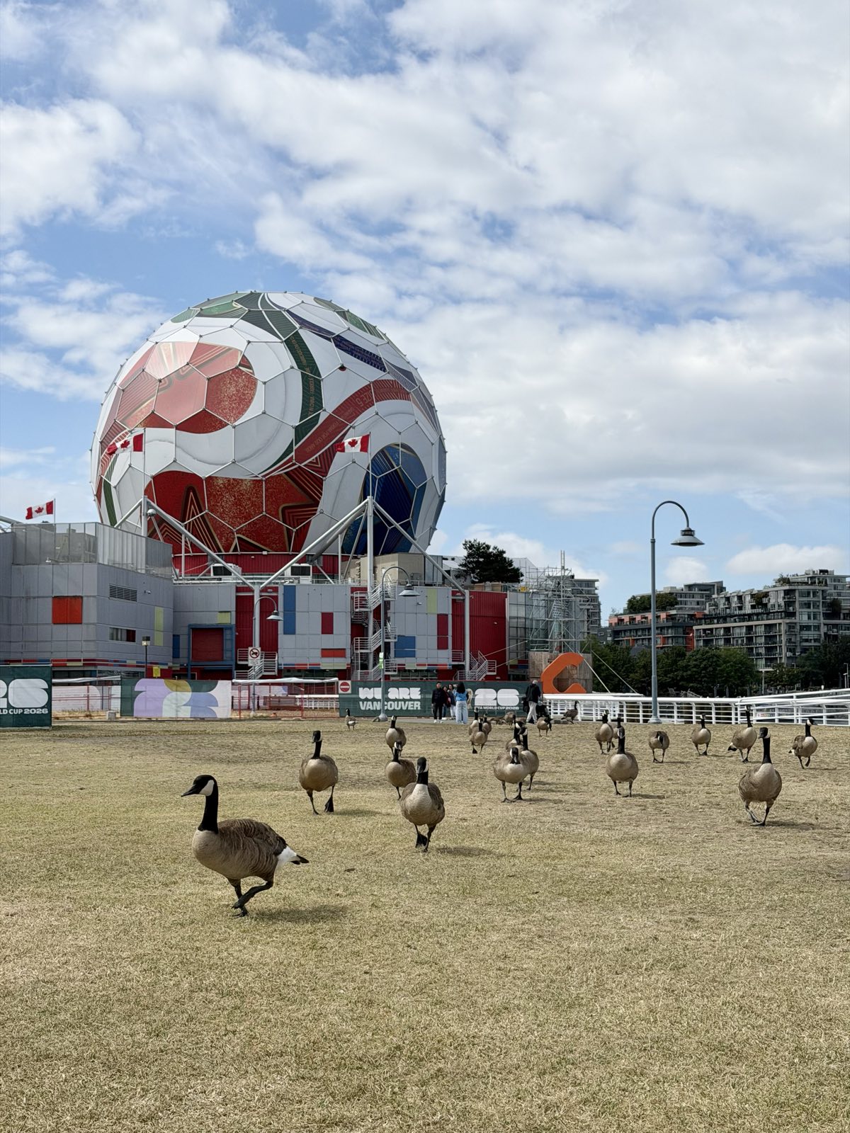 Science World in Vancouver dressed as a FIFA World Cup 2026 ball, with Canada geese on the lawn